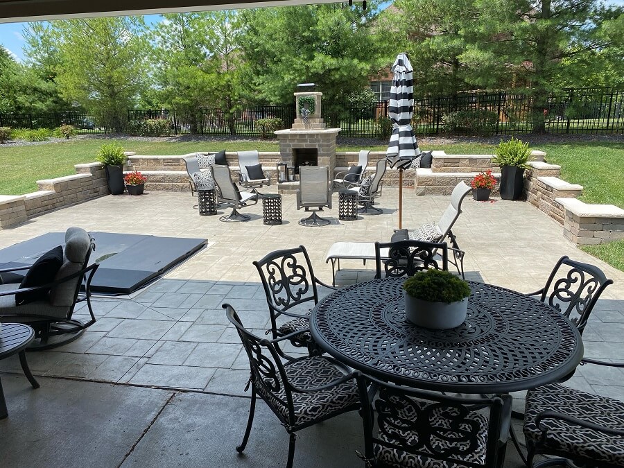 Backyard patio with stone kitchen fireplace
