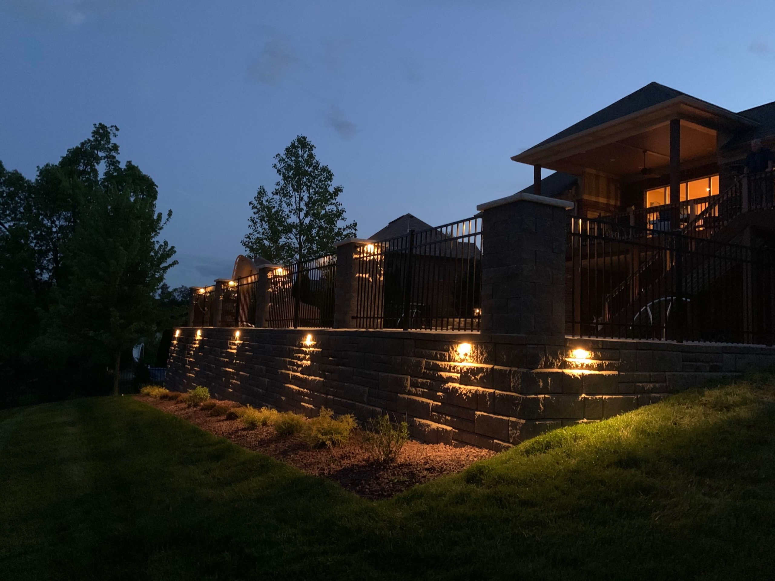 Lighted backyard terrace at night