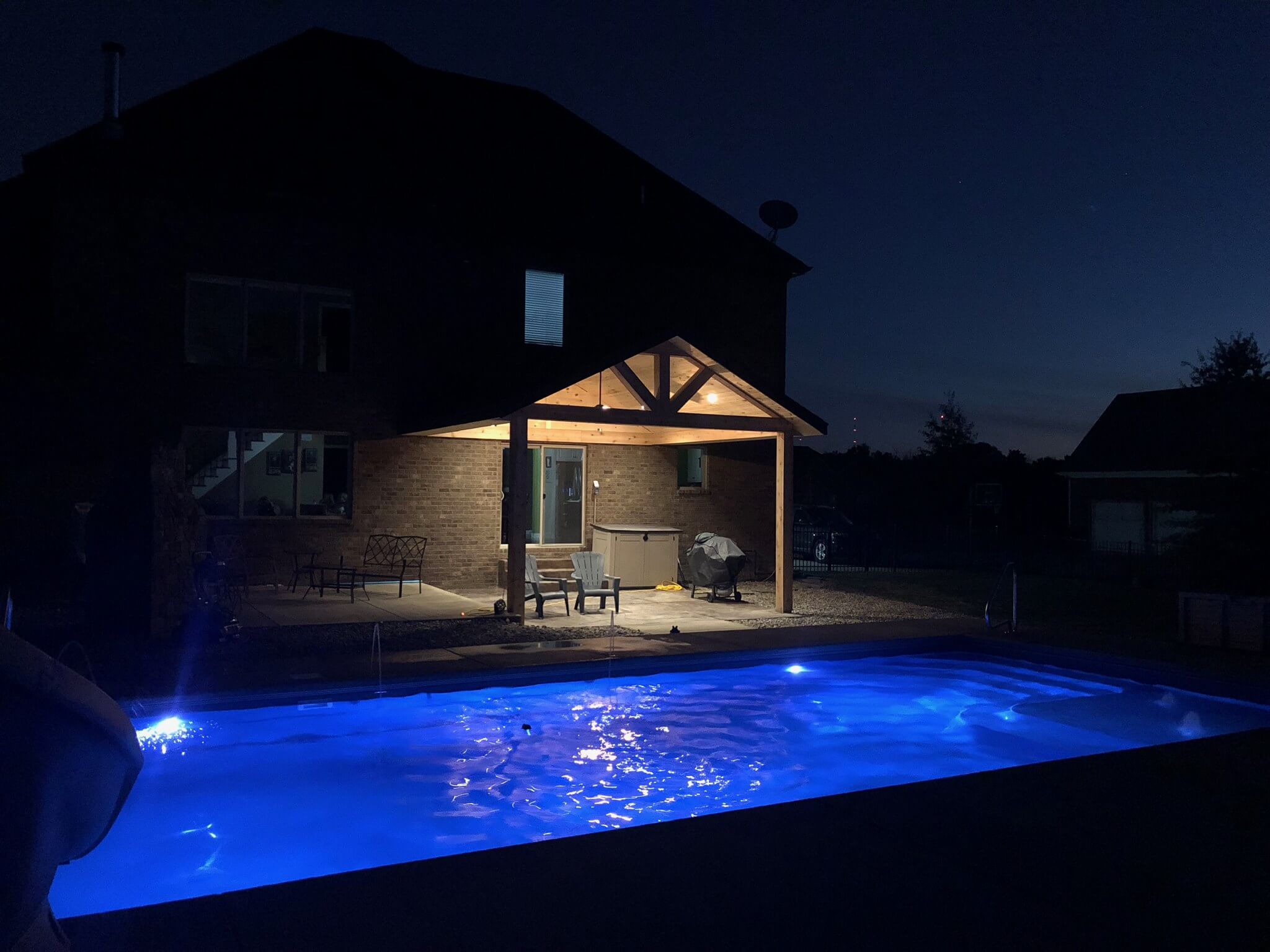 Bright blue pool lighting at night